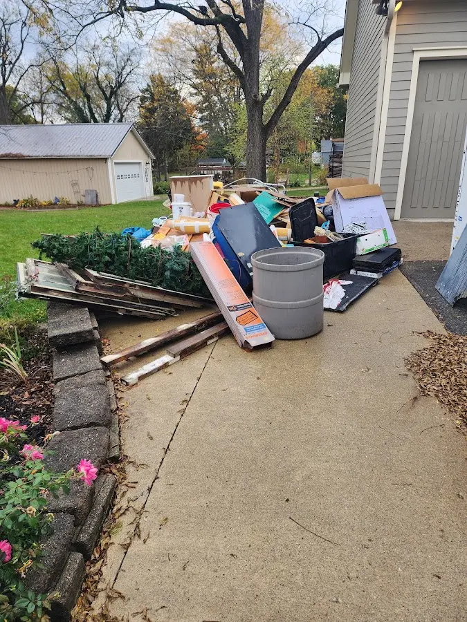 Dumpster being loaded with debris for 30 Yard Dumpster Rental in Neptune